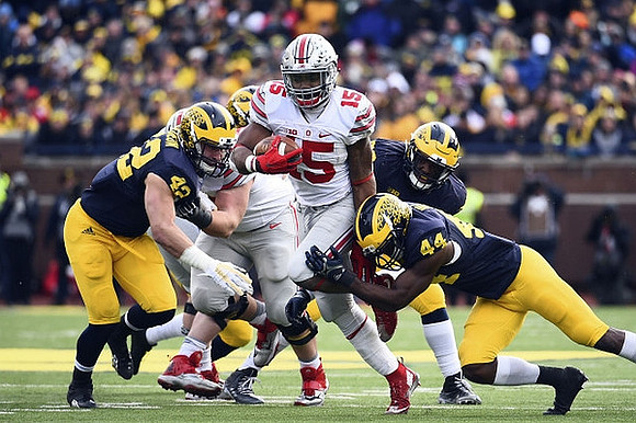 Chris Wormley (43) and Delano Hill (44)