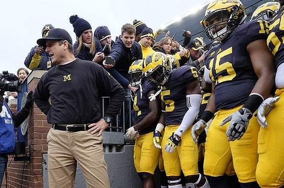 Jim Harbaugh, De'Veon Smith (4), Jabrill Peppers (5), and Jake Rudock (15)