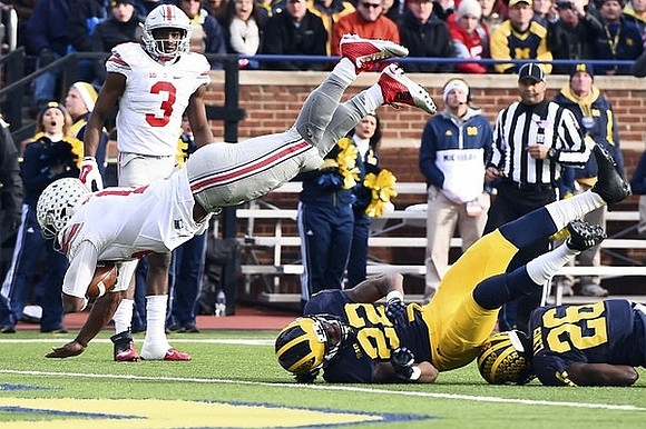 Jarrod Wilson (22) and Jourdan Lewis (26)