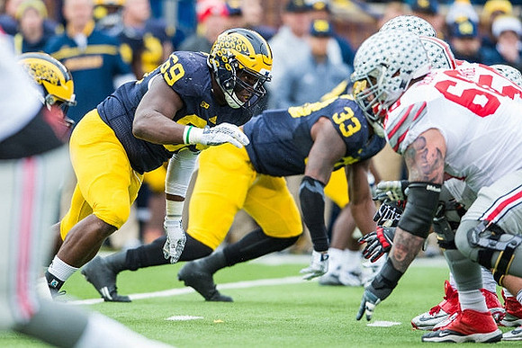 Willie Henry (69) and Taco Charlton (33)