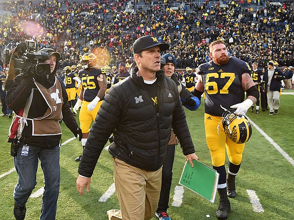David Dawson (55), Jim Harbaugh, and Kyle Kalis (67)