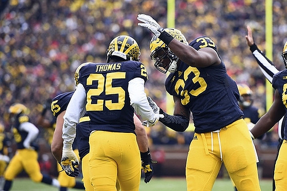 Dymonte Thomas (25), Taco Charlton (33), and Desmond Morgan (3)