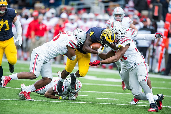Ben Braden (71) and De'Veon Smith (4)