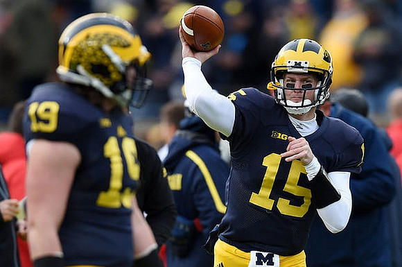 Henry Poggi (19) and Jake Rudock (15)