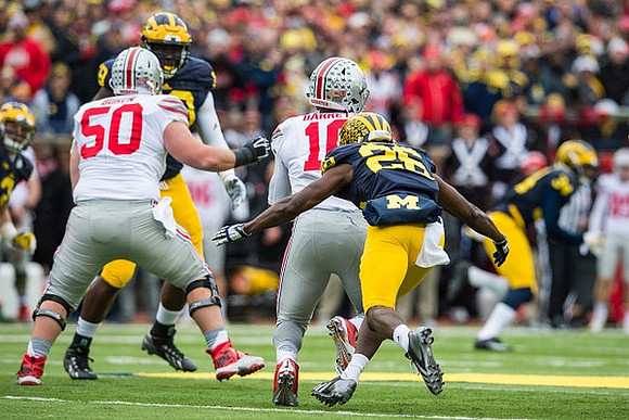 Willie Henry (69) and Jourdan Lewis (26)