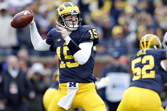 Jake Rudock (15) and Mason Cole (52)