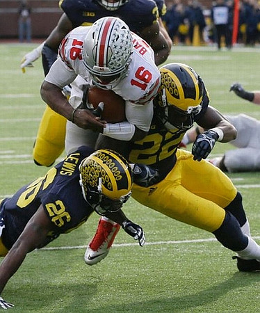 Jourdan Lewis (26) and Jarrod Wilson (22)