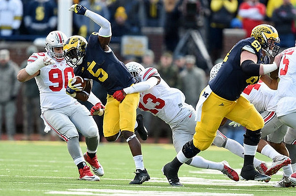 Jabrill Peppers (5) and Graham Glasgow (61)