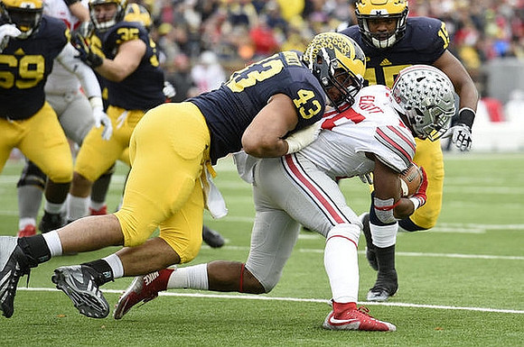 Willie Henry (69), Joe Bolden (35), Chris Wormley (43), and James Ross (15)