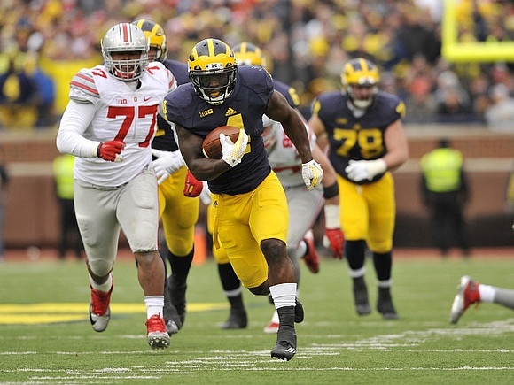 De'Veon Smith (4) and Erik Magnuson (78)