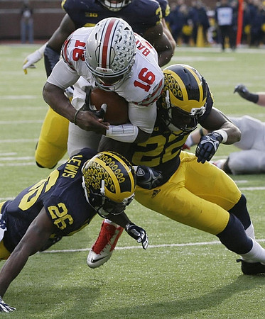 Jourdan Lewis (26), Jarrod Wilson (22), and Taco Charlton (33)