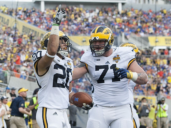 Drake Johnson (20) and Ben Braden (71)
