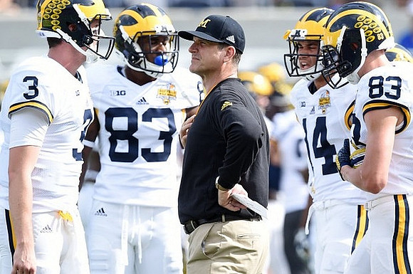 Wilton Speight (3), Jaron Dukes (83), Jim Harbaugh, and Drake Harris (14)