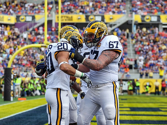 Drake Johnson (20) and Kyle Kalis (67)