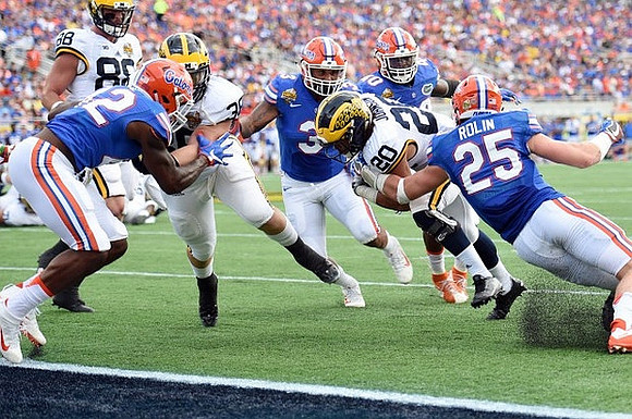 Jake Butt (88), Joe Kerridge (36), and Drake Johnson (20)