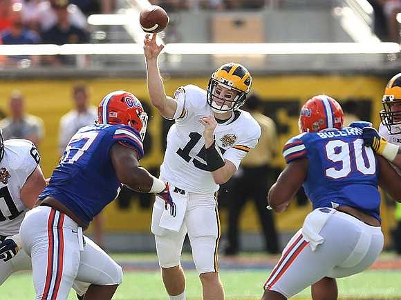 Graham Glasgow (61) and Jake Rudock (15)