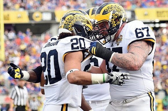 Drake Johnson (20) and Kyle Kalis (67)