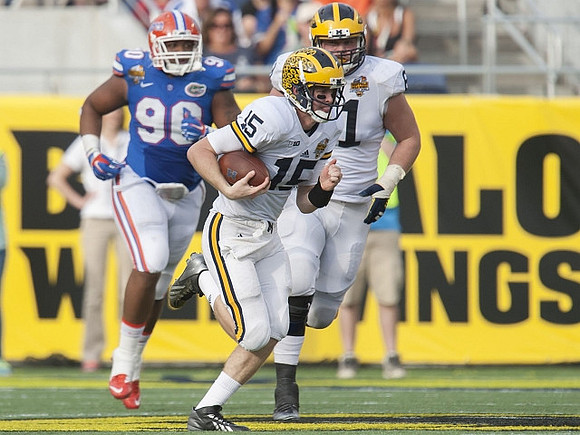 Jake Rudock (15) and Ben Braden (71)