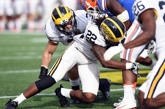 Desmond Morgan (3), Jarrod Wilson (22), and Jourdan Lewis (26)