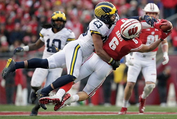 Devin Bush (10) and Tyree Kinnel (23)