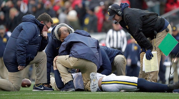 Brandon Peters (18) and Jim Harbaugh