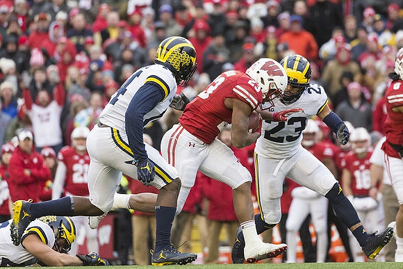 Josh Metellus (14) and Tyree Kinnel (23)