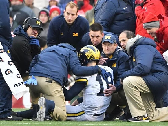 Jim Harbaugh and Brandon Peters (18)