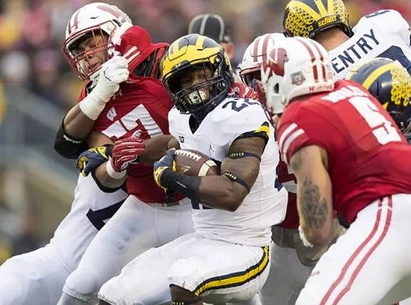 Karan Higdon (22) and Zach Gentry (83)