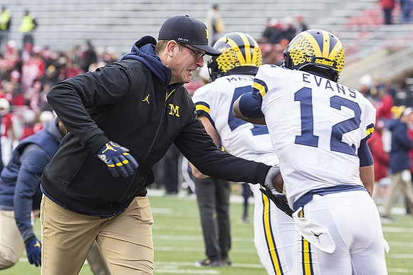 Jim Harbaugh, Ben Mason (42), and Chris Evans (12)