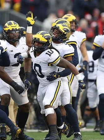 Rashan Gary (3), Devin Bush (10), and Khaleke Hudson (7)