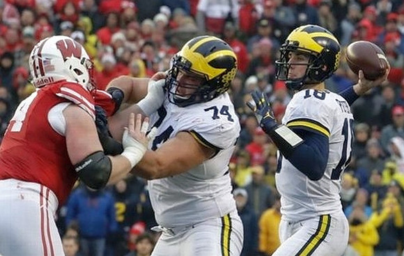 Ben Bredeson (74) and Brandon Peters (18)