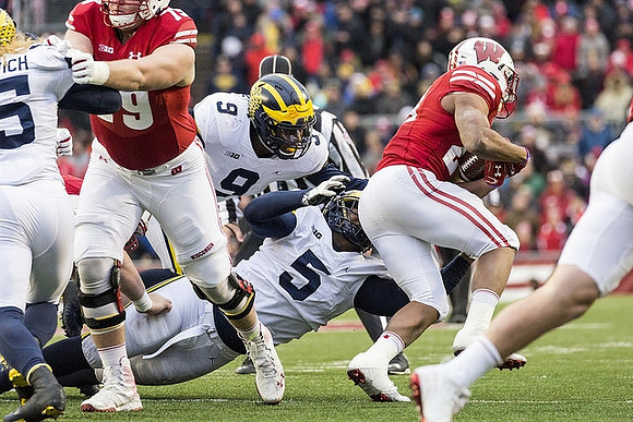 Chase Winovich (15), Mike McCray (9), and Aubrey Solomon (5)