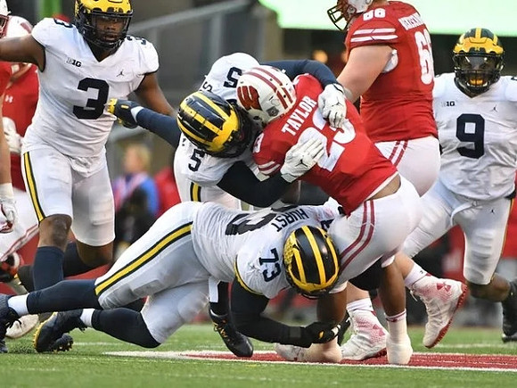 Rashan Gary (3), Aubrey Solomon (5), Maurice Hurst (73), and Mike McCray (9)