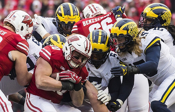 Maurice Hurst (73), Mike McCray (9), Aubrey Solomon (5), Chase Winovich (15), and Devin Bush (10)