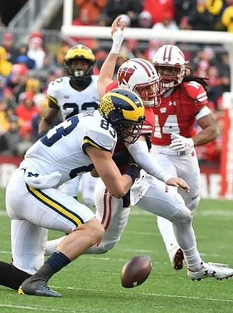 Karan Higdon (22) and Zach Gentry (83)