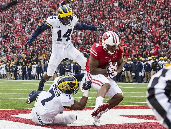 Josh Metellus (14) and Khaleke Hudson (7)