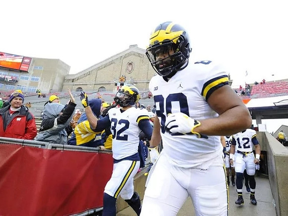 Ty Isaac (32) and Khalid Hill (80)