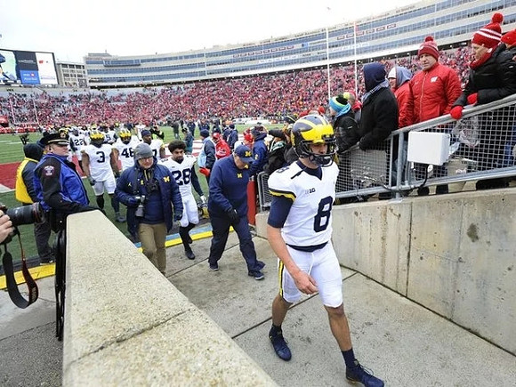 John O'Korn (8) and Michigan Team