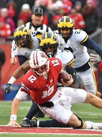 Chase Winovich (15), Khaleke Hudson (7), and Carlo Kemp (2)