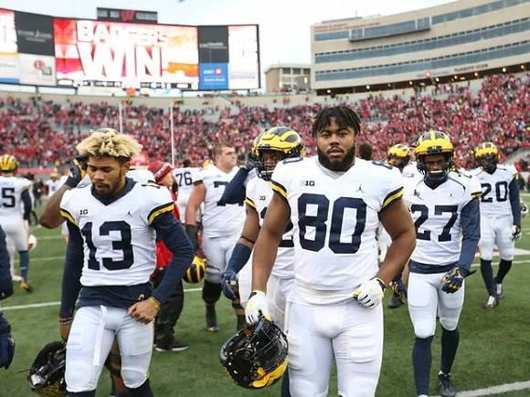Eddie McDoom (13), Khalid Hill (80), and Hunter Reynolds (27)