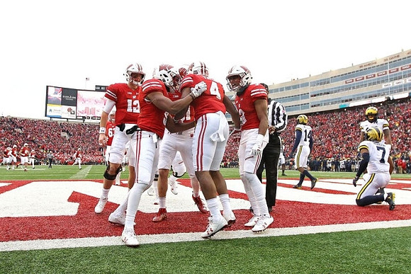Josh Metellus (14) and Khaleke Hudson (7)