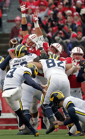 Michael Onwenu (50), Quinn Nordin (3), Garrett Moores (15), and Nick Eubanks (82)