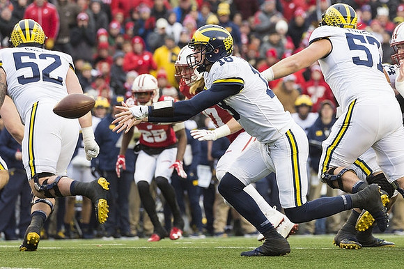 Mason Cole (52), Brandon Peters (18), and Patrick Kugler (57)
