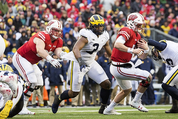 Rashan Gary (3) and Chase Winovich (15)