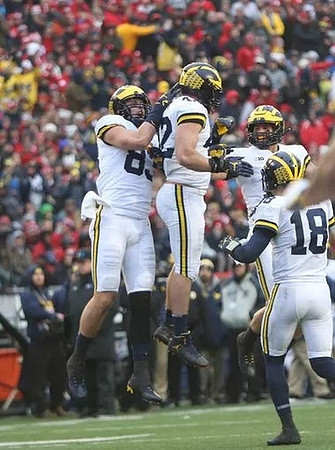 Zach Gentry (83), Ben Mason (42), and Brandon Peters (18)