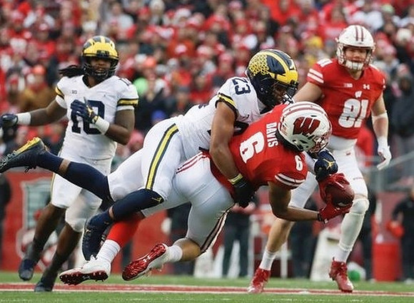 Devin Bush (10) and Tyree Kinnel (23)