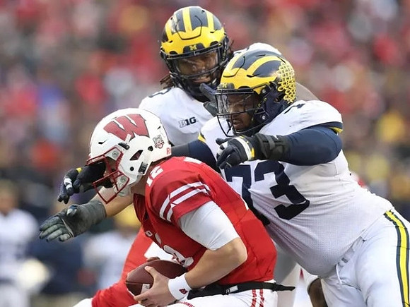 Rashan Gary (3) and Maurice Hurst (73)