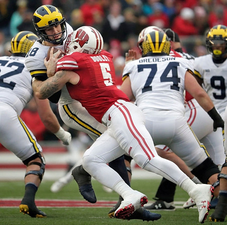 Mason Cole (52), Brandon Peters (18), Ben Bredeson (74), and Donovan Peoples-Jones (9)