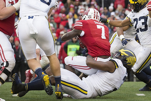Rashan Gary (3) and Tyree Kinnel (23)
