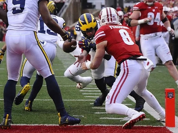Donovan Peoples-Jones (9), Eddie McDoom (13), and Brandon Peters (18)